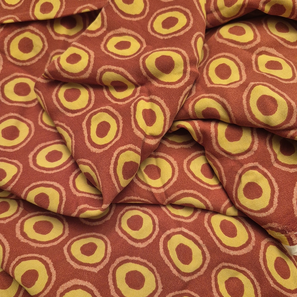 Vibrant Patterned Fabric in Red and Yellow